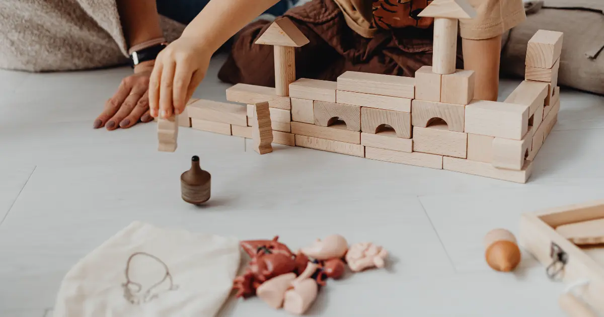 Child using toys and art supplies in a relaxed therapy environment